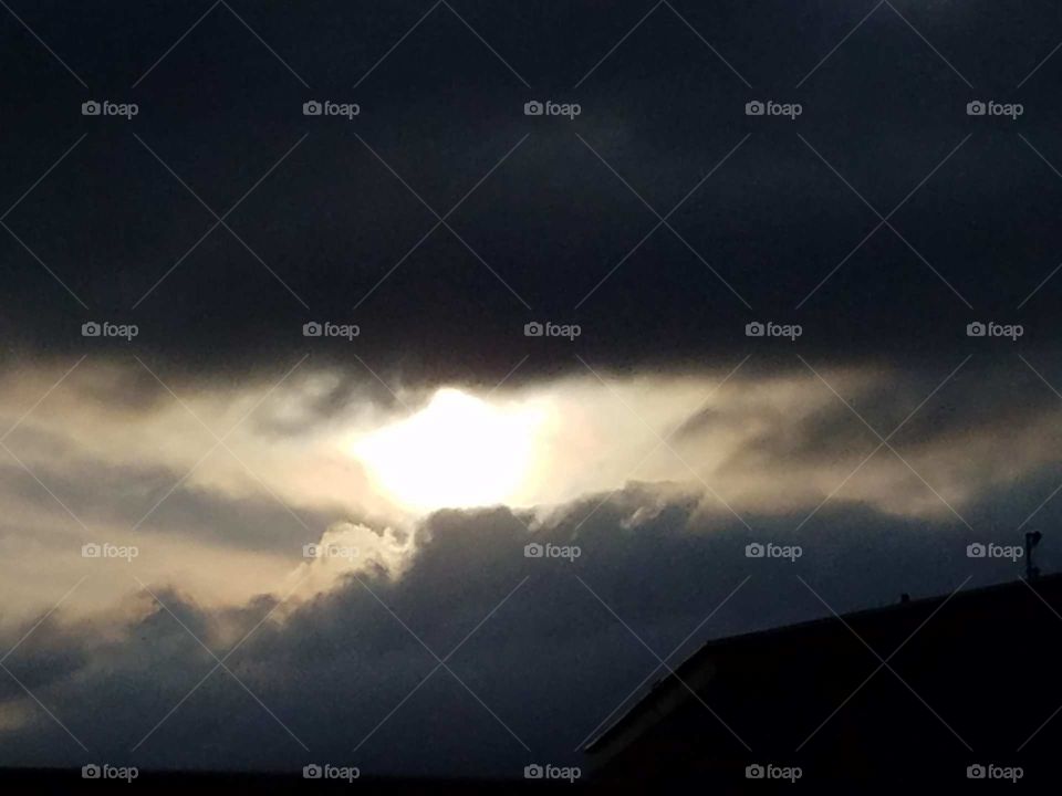Sun in dark clouds
