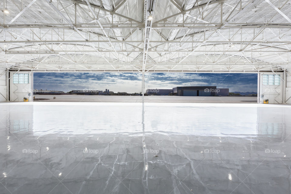 Inside Airport Hangar Looking Out Open Doors