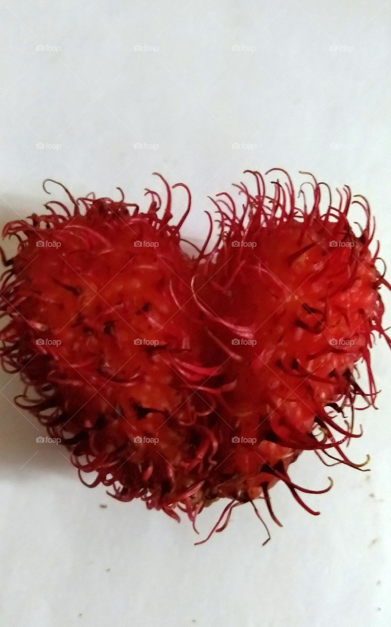 This fruit called rambutan in Indonesia, the shape is unique "love or heart" it is real, not fake