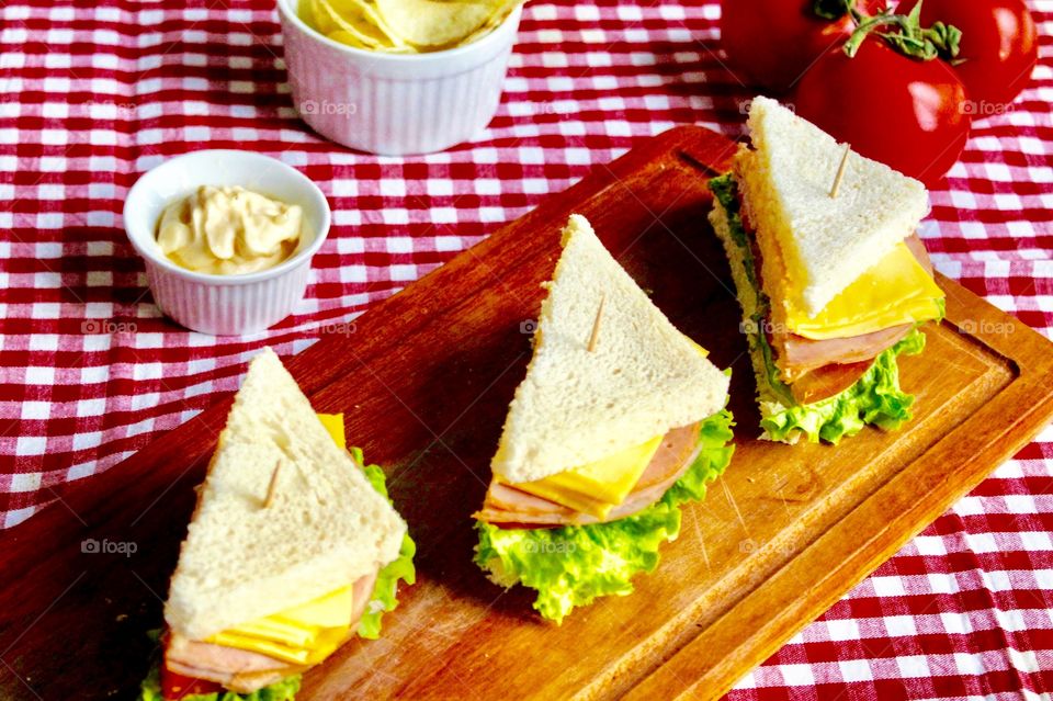 Sandwich triangle of ham, cheese and salad