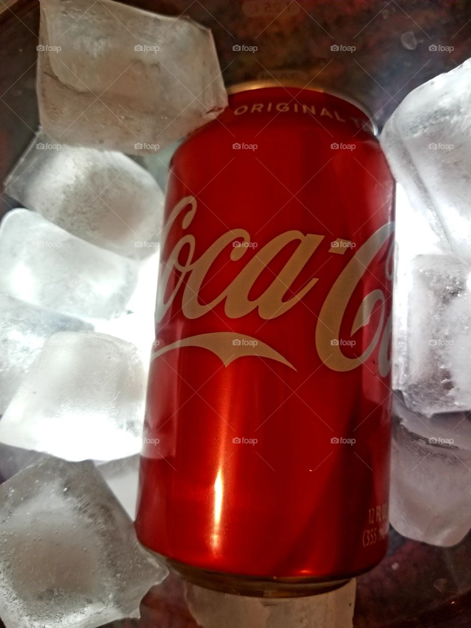 coca-cola fizzy drink on ice