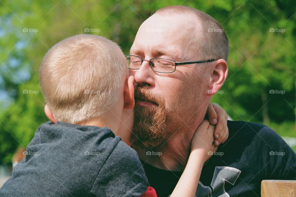 Father and son in a hug