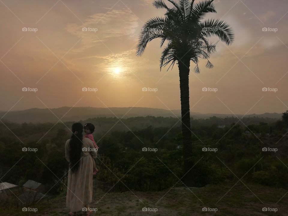 Mother and her baby looking toward their Future