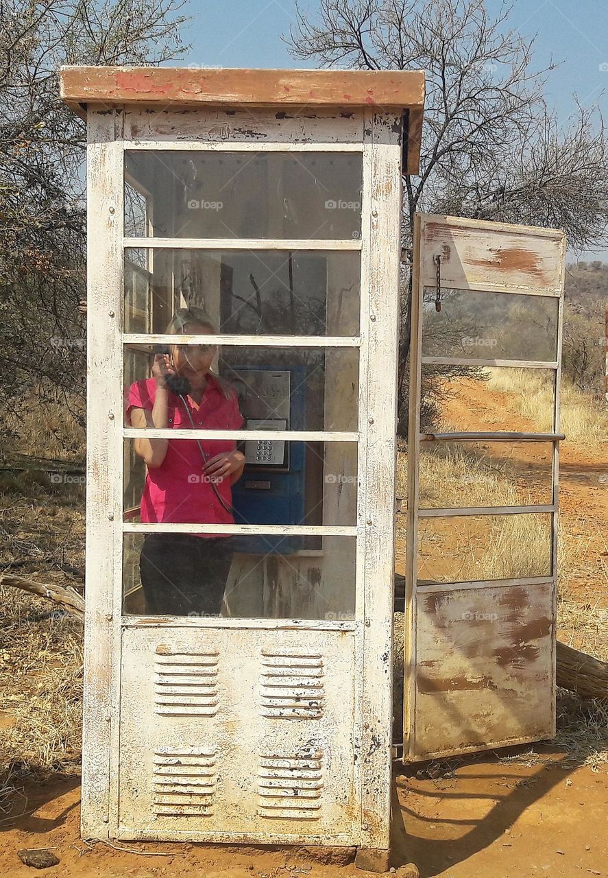 woman in a phonebooth