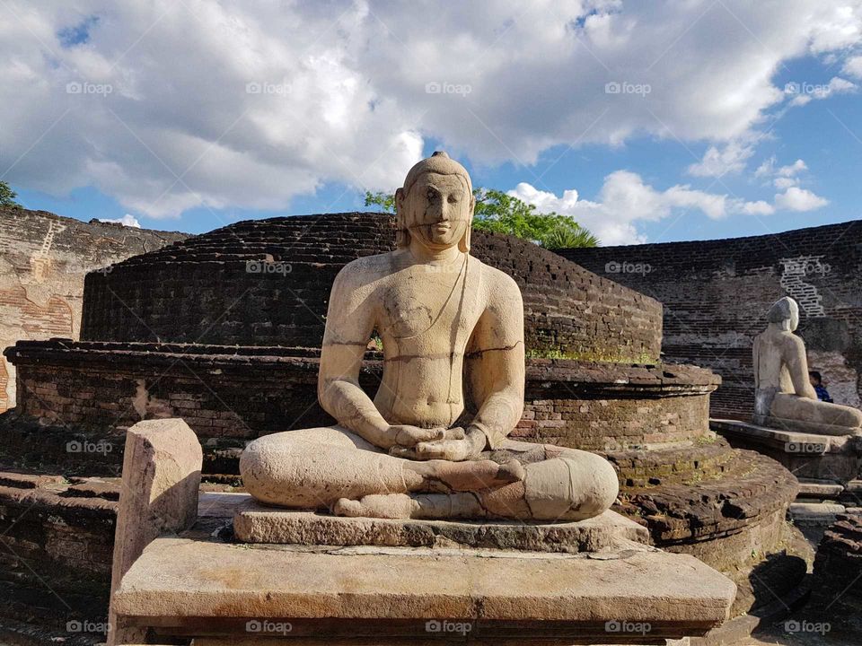An ancient 2000 year old Buddha statue in Sri Lanka, the ancient capital city of Polonnaruwa. This statue is one of the UNESCO World Heritage Statue.