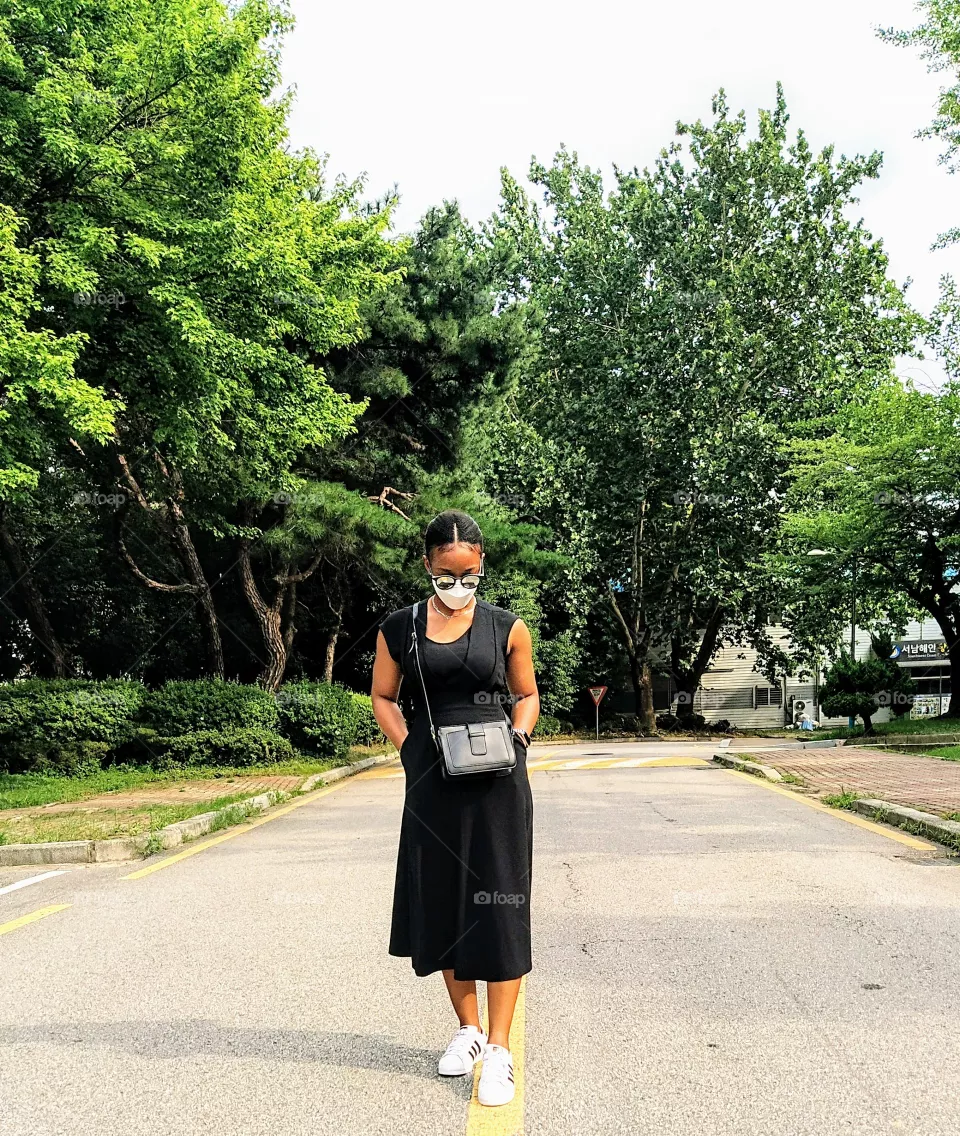 Taking a walk on a black and white outfit on a sunny day