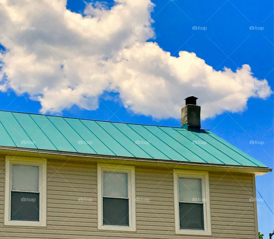 Cloud Over Roof of House