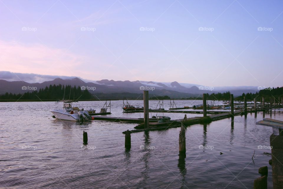 This is a marina on the nehalem bay located in in Wheeler oregon near dusk.