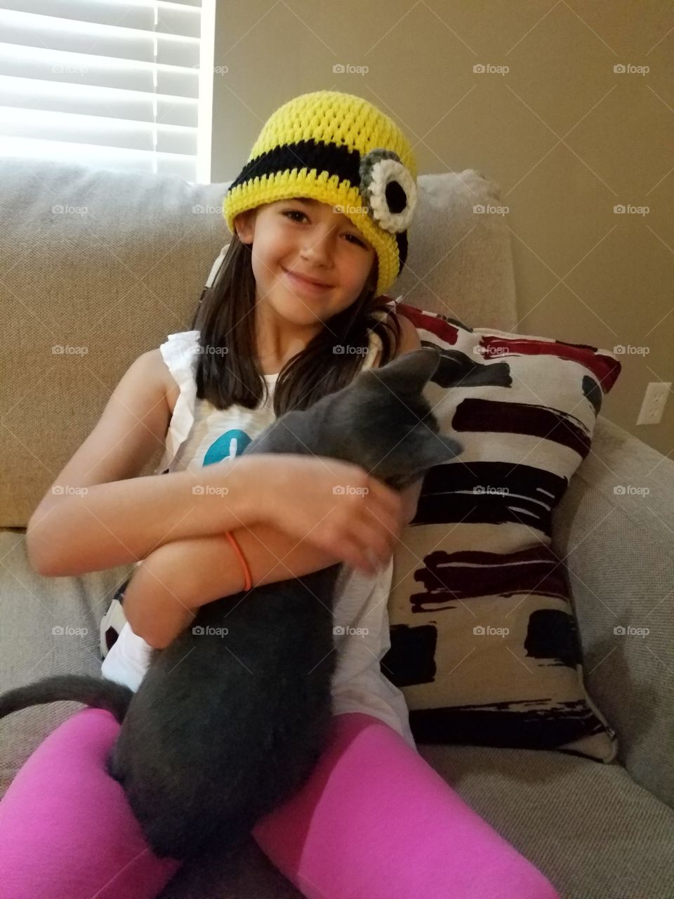 A Girl and her Cat in A Hat