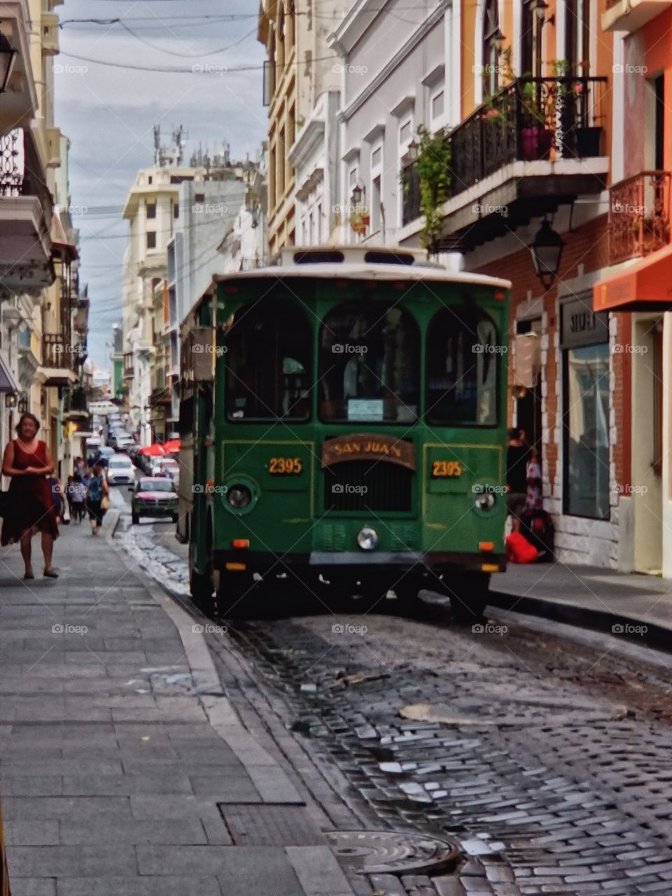 Trolley car cruising down and old brick road