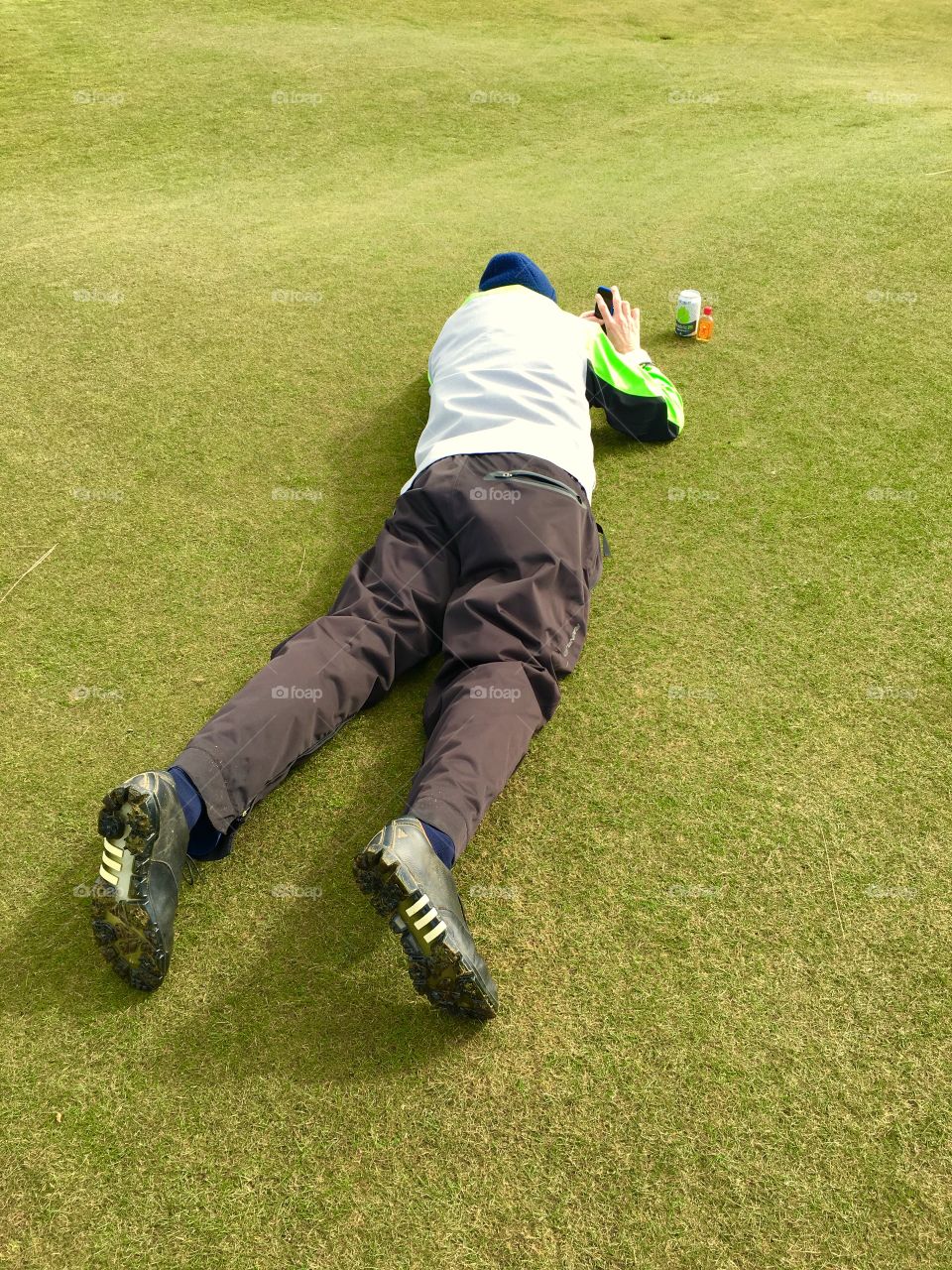 Getting a photo on the golf course with ocean in background and mini alcohol bottles in foreground.