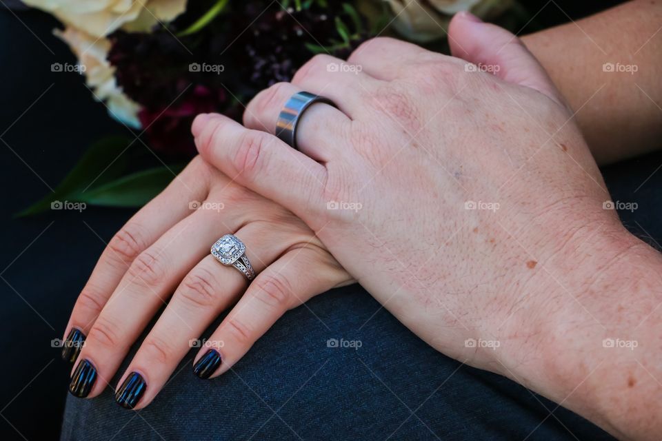 Wedding couple holding hands