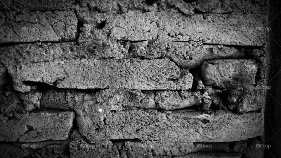 Abstract background of eroded stone wall