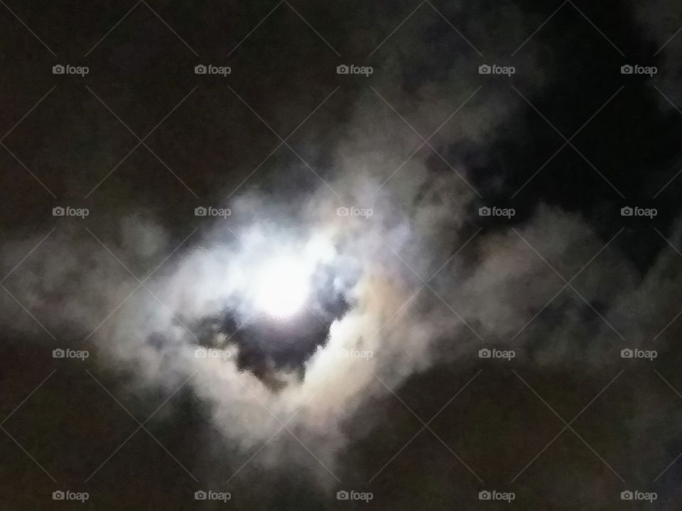 moon going behind clouds