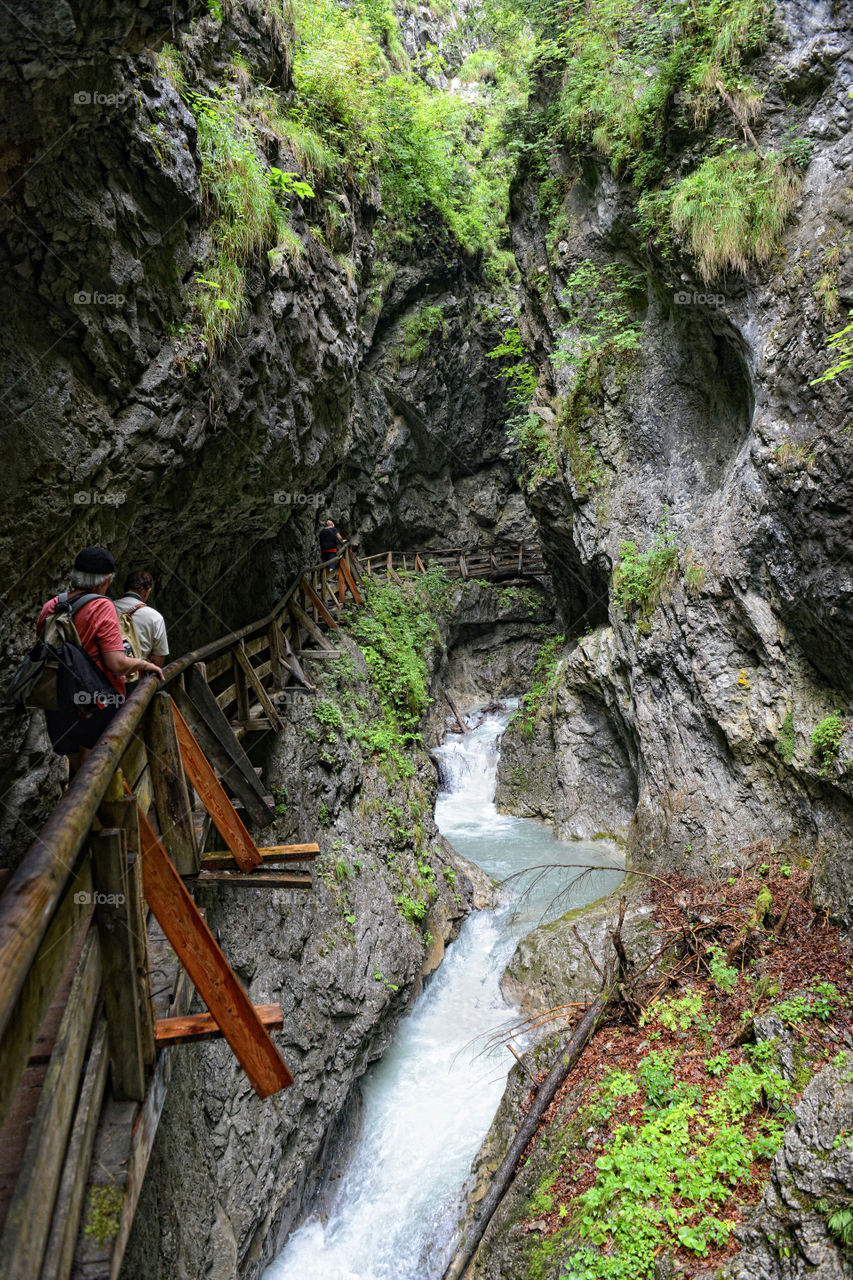 Hiking through the wolfsklamm gorge in tirol, next to village stans in austria.