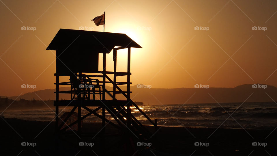 sunset sea lifeguard dusk by snappychappie