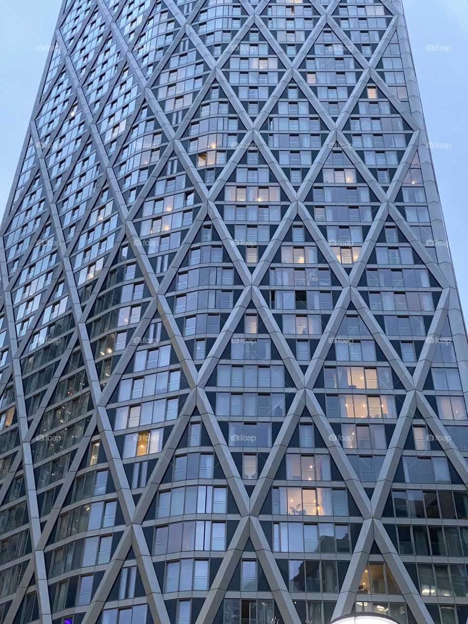 Facade of building in London with illuminated windows