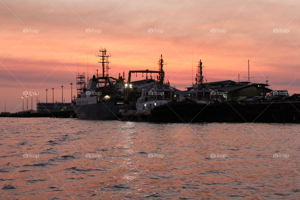 Ships tied up in a typical Darwin sunset