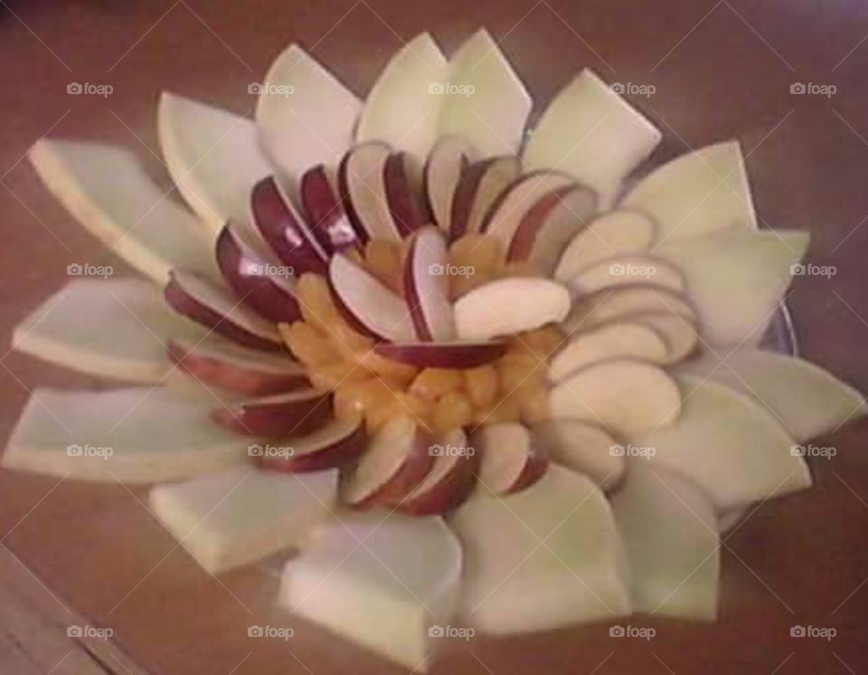 Flowering Fruit. Fruit platter with apples, honeydew, and mandarin oranges.