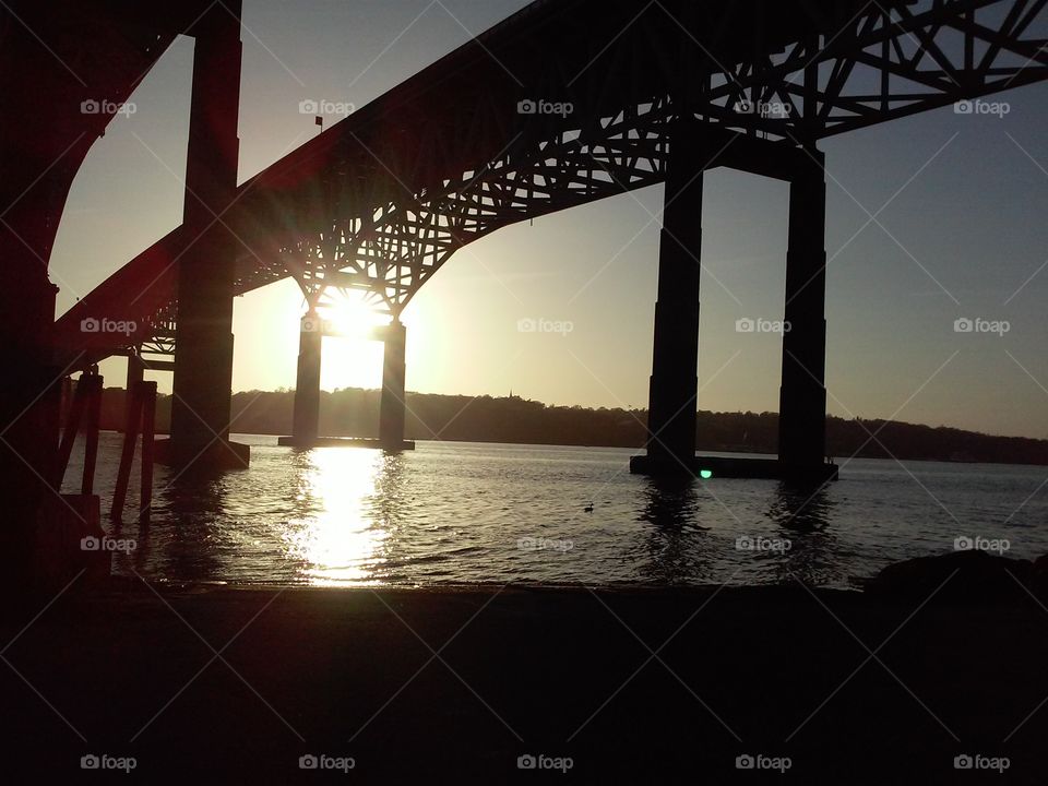 A summer sun setting beyond the Gold Star Bridge in Southeastern Connecticut [original photo].