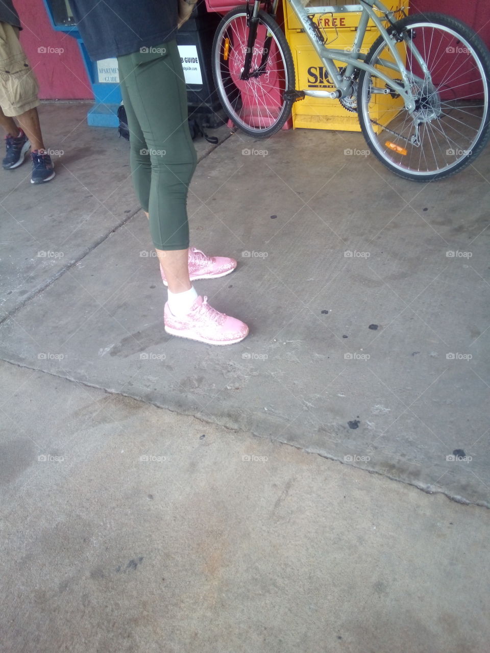 he thinks these pink bling bling tennis shoes and Spandex looks good everyone is unique.