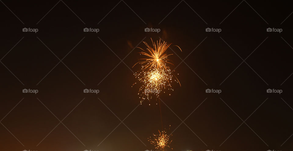 Close-up of firework in sky at night