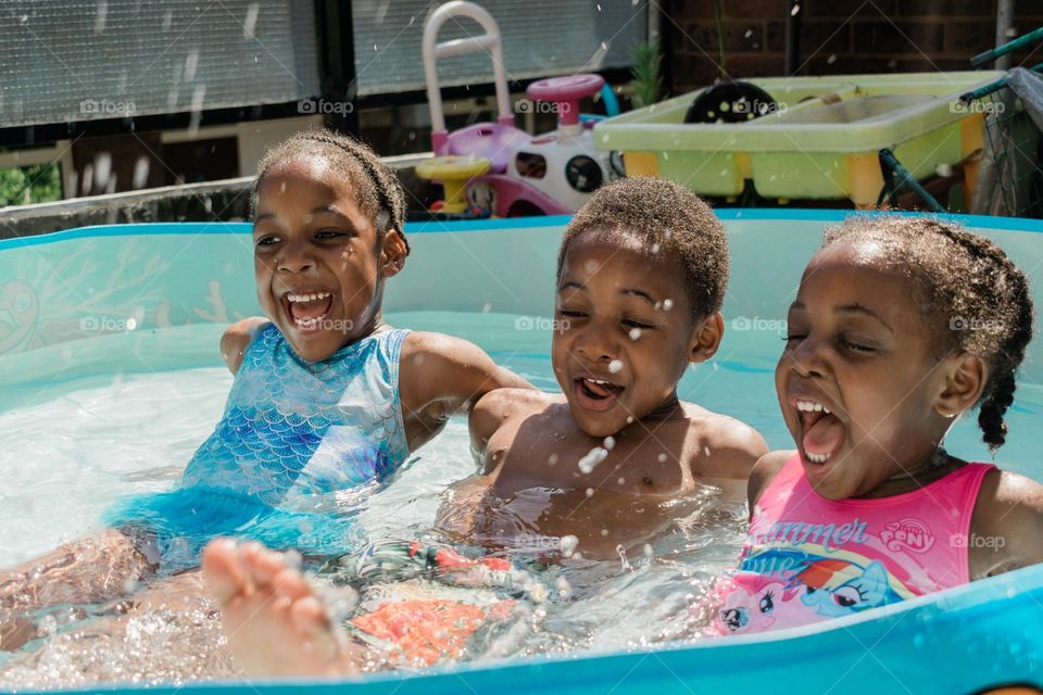 see these happy african children in swimming pool on their birthday,what a happy day