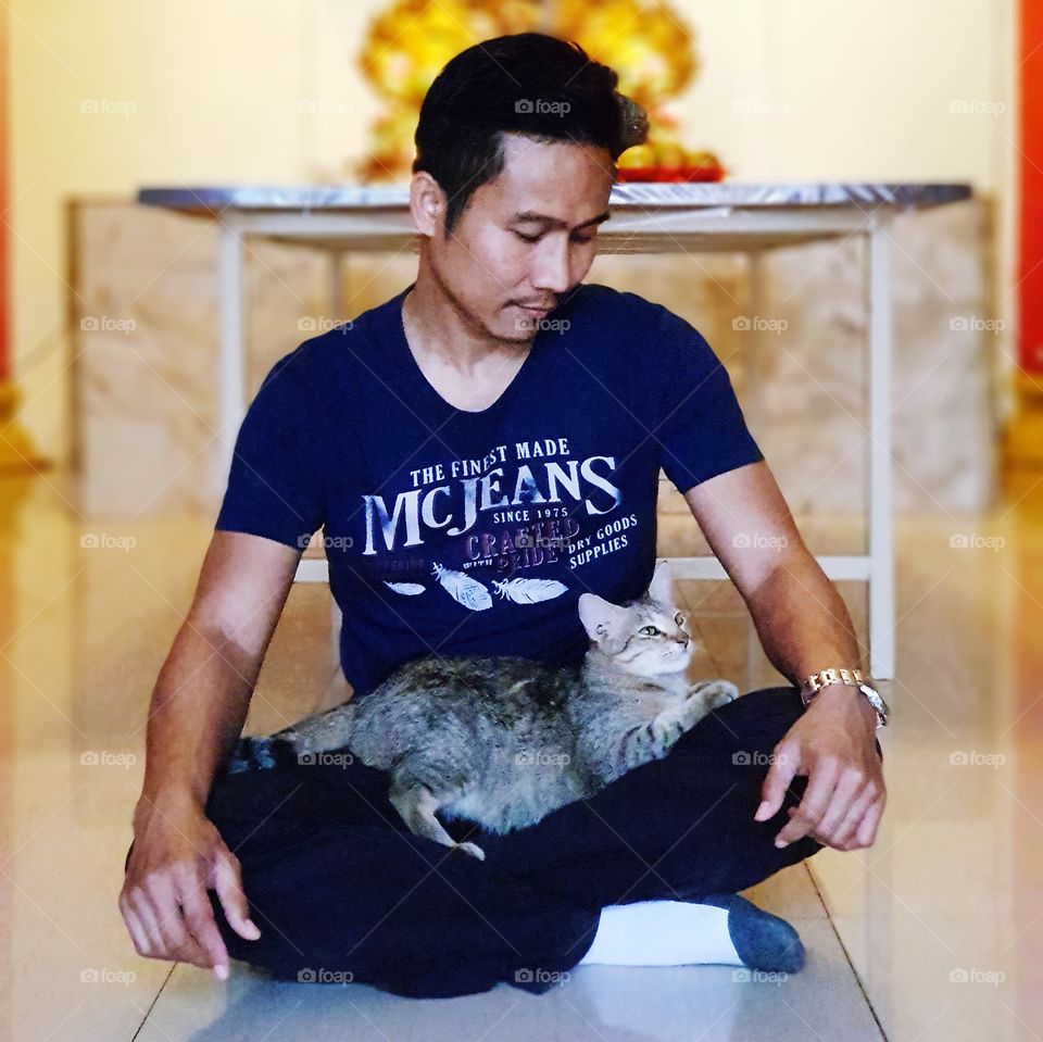 Man sitting with cat