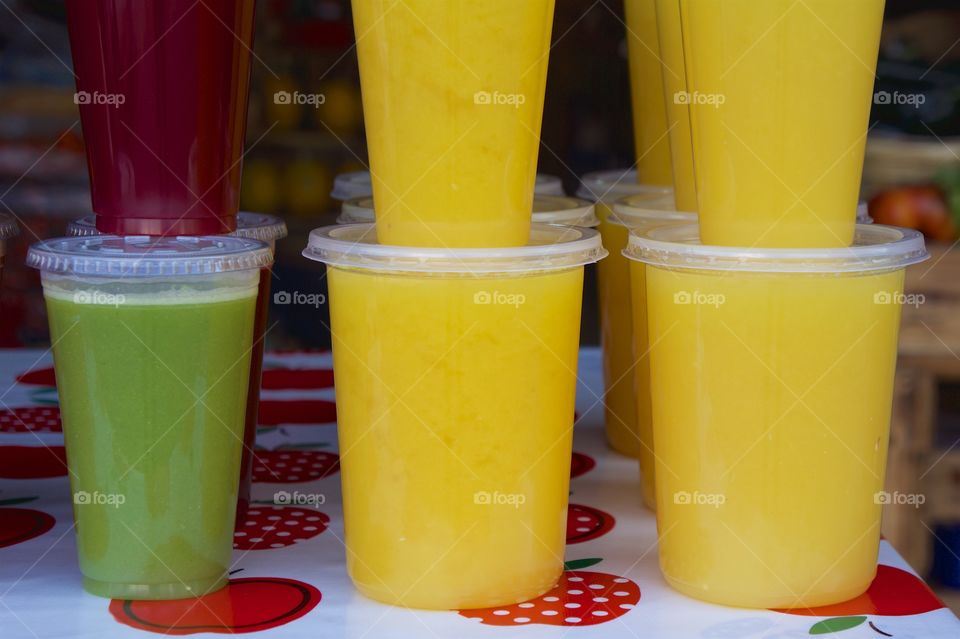 Multicolor juice cup on table