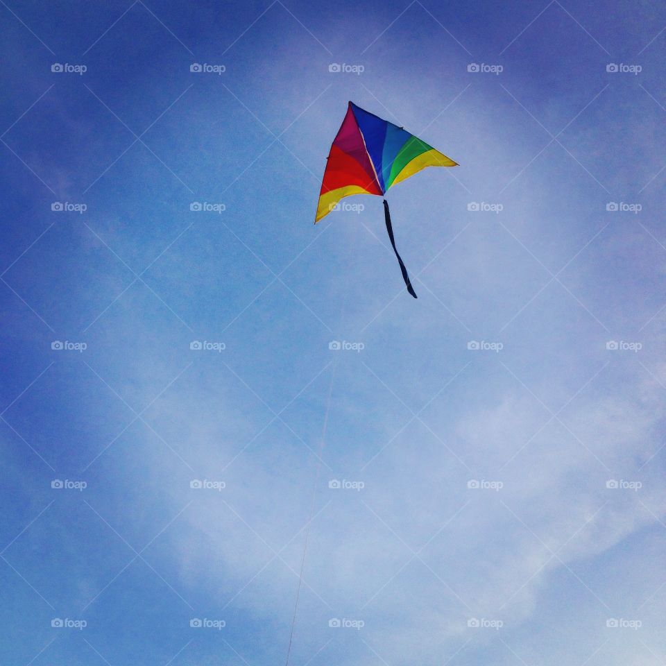 Rainbow kite flying in the sky