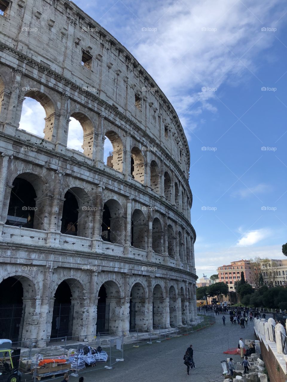The imposing and always impressive gray wall of the Colosseum on a clear, crisp day. 