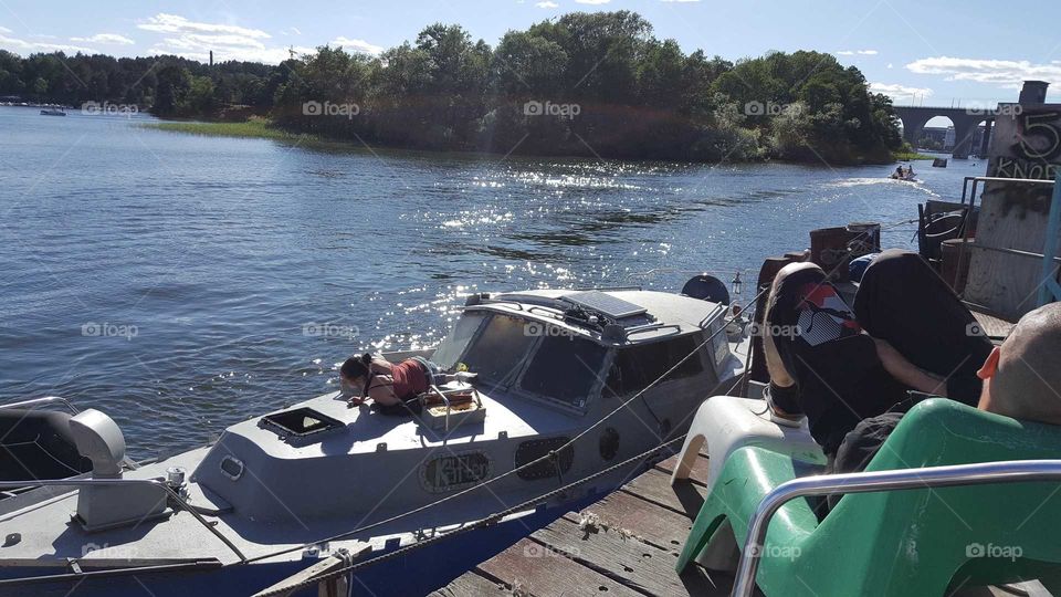 Motorboat at the pirate harbour occupied by several homeless people with the good will of the owner.