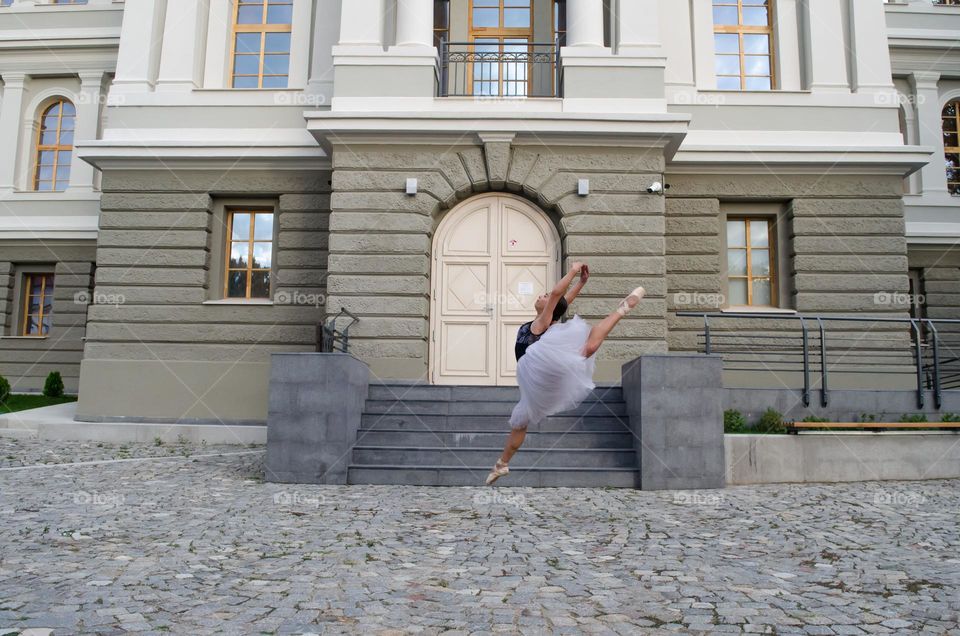 Young Female Ballerina Dancing Outside