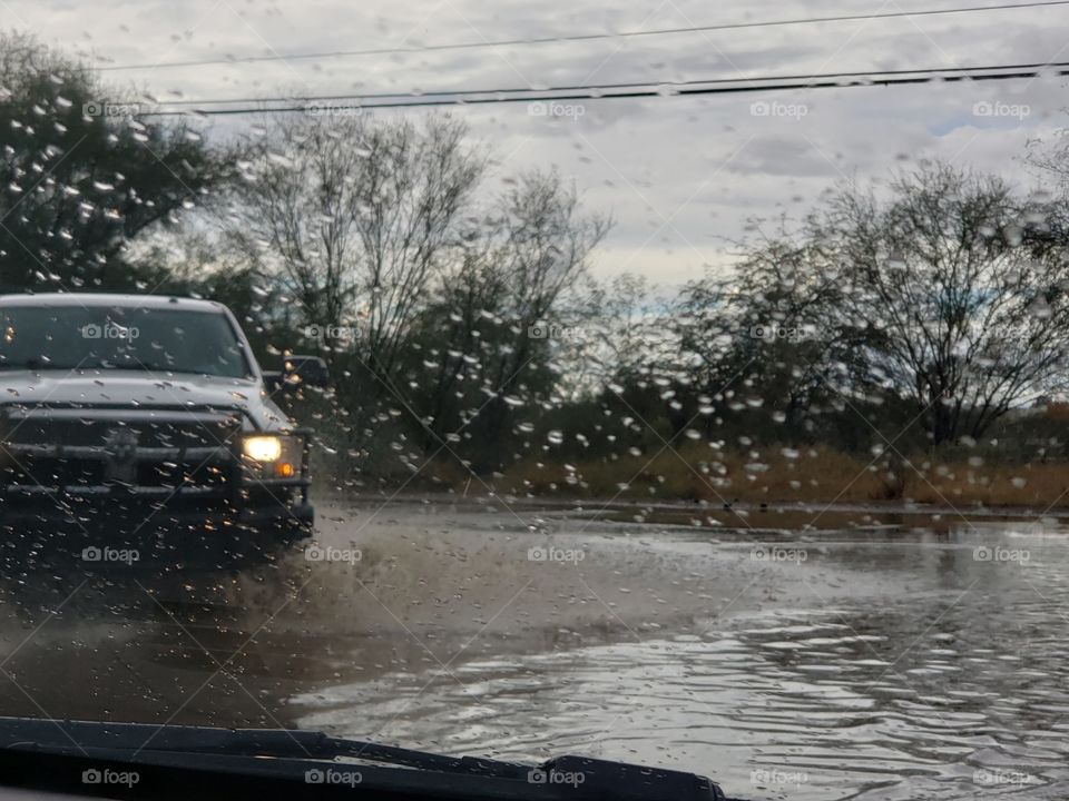 going through the puddles during a down pour.