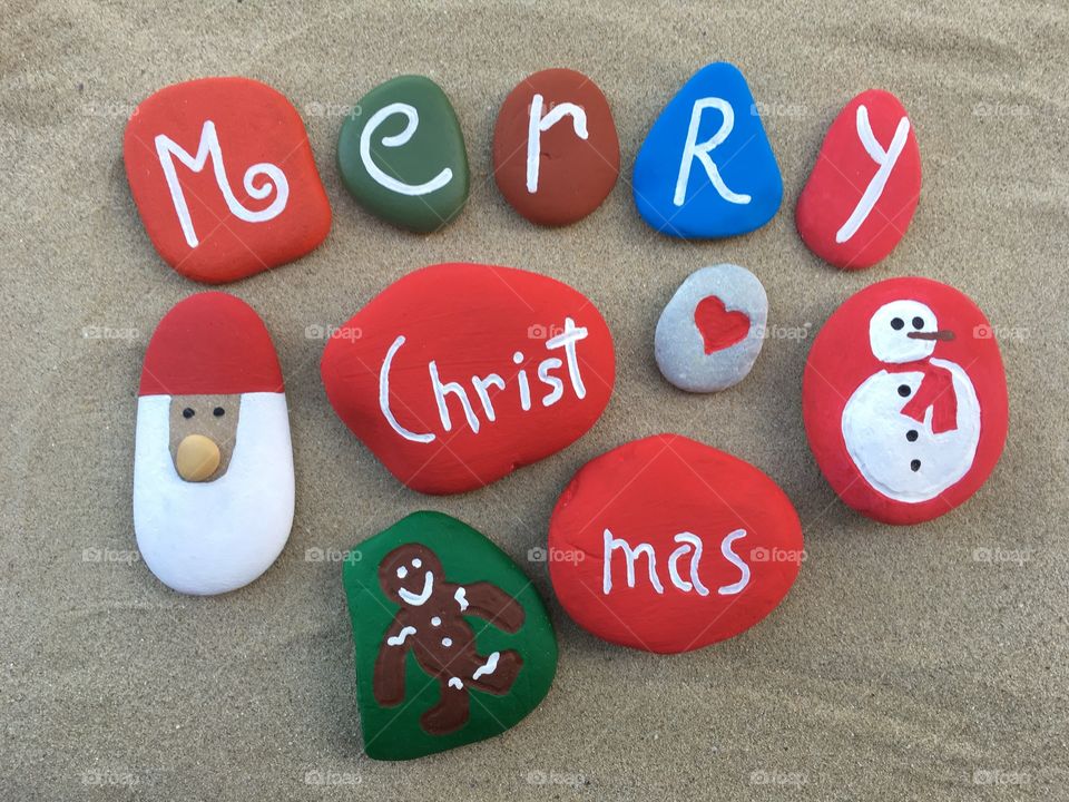 Merry Christmas message on colored stones 