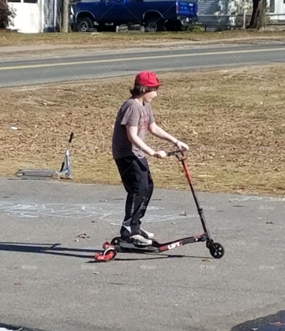 Kid playing on tarred area