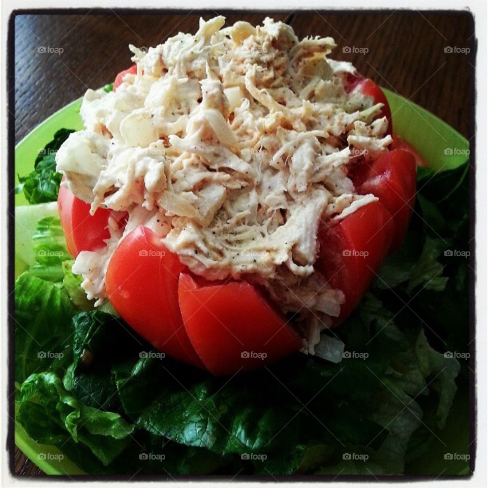 Stuffed tomato . Chicken salad