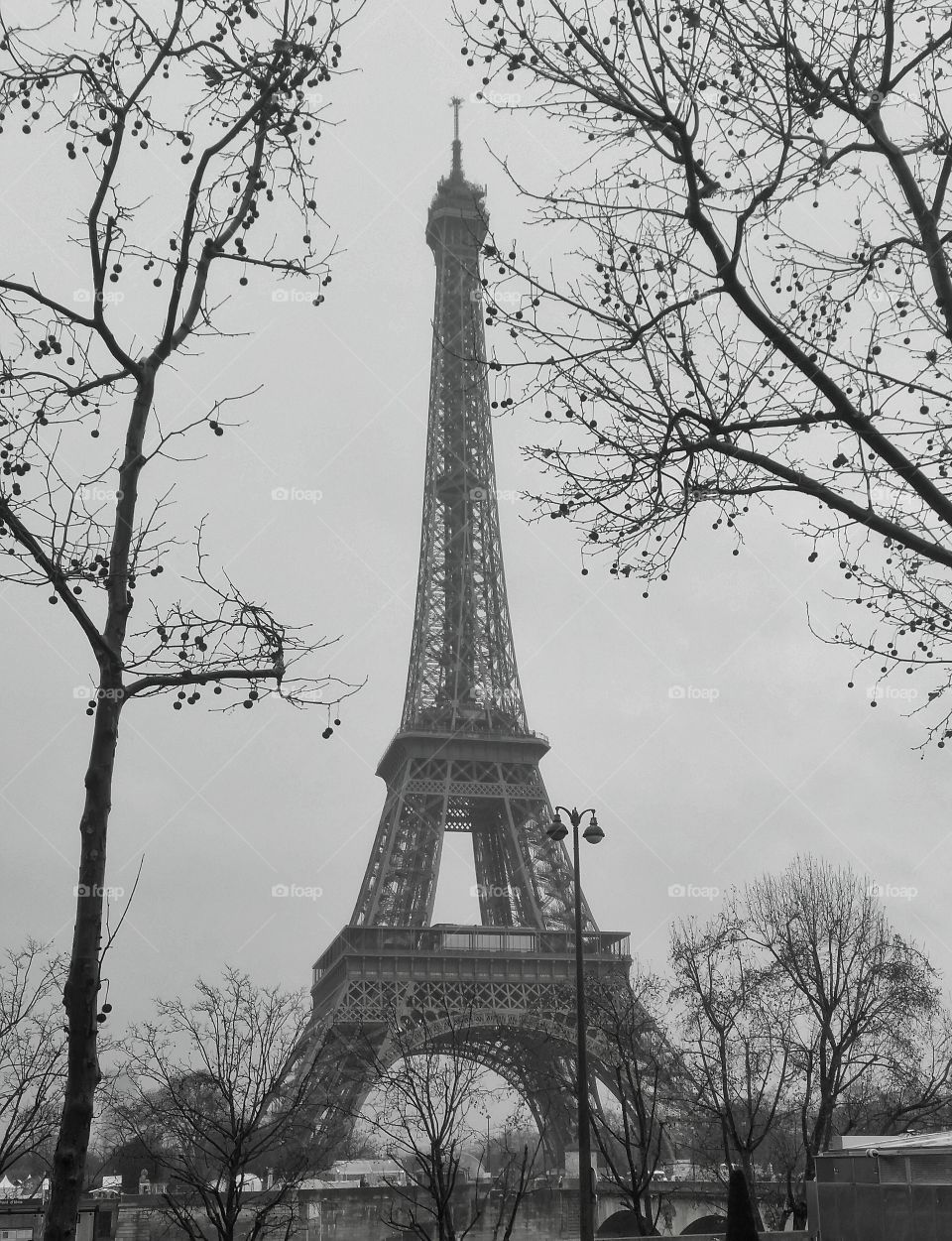 The Eiffel Tower. The Eiffel Tower on a cloudy, rainy day in Paris. 