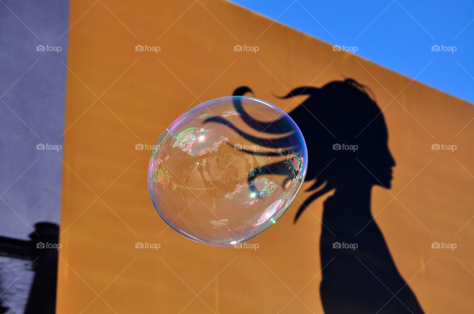 soap bubble on the orange wall background