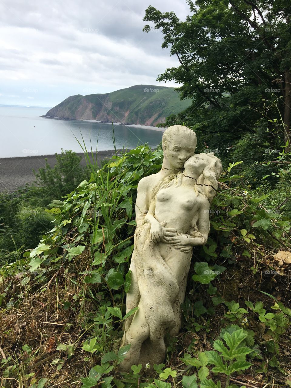 Male and female sculpture in the foreground and the gorgeous North Devon coastline in the background. Stunning Lynton and Lynmouth. 