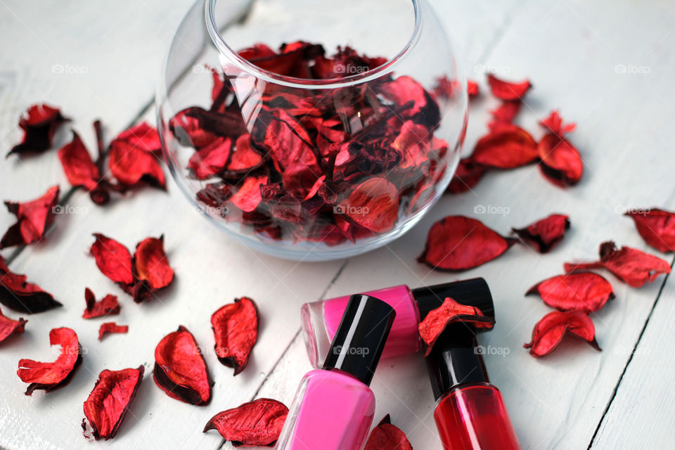 Beauty, health, spa and personal care: nail polish, flowers, rose petals