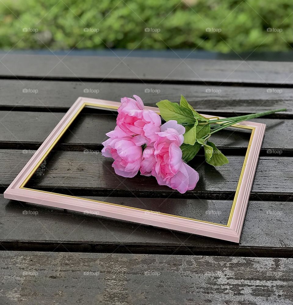 Wooden photo frame on wooden table 