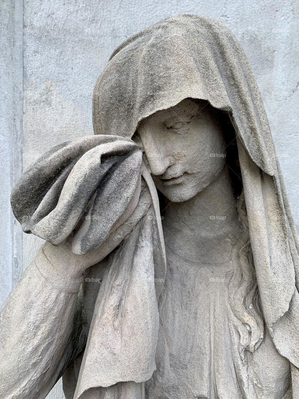 detail of one of the two statues at the entrance to the mausoleum of Alessandro Volta, in Camnago Volta, near the city of Como