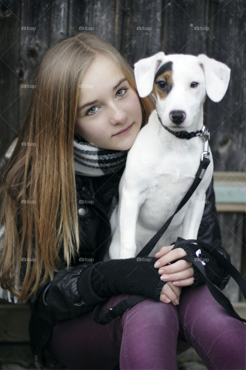 a girl with her dog for a portrait outdoor 