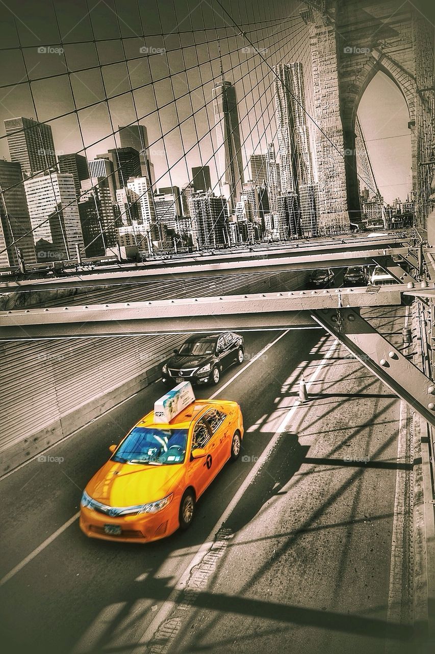 Yellow cab at the Brooklyn bridge