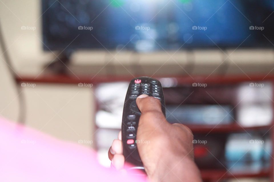 Hand holding Ramote control tv