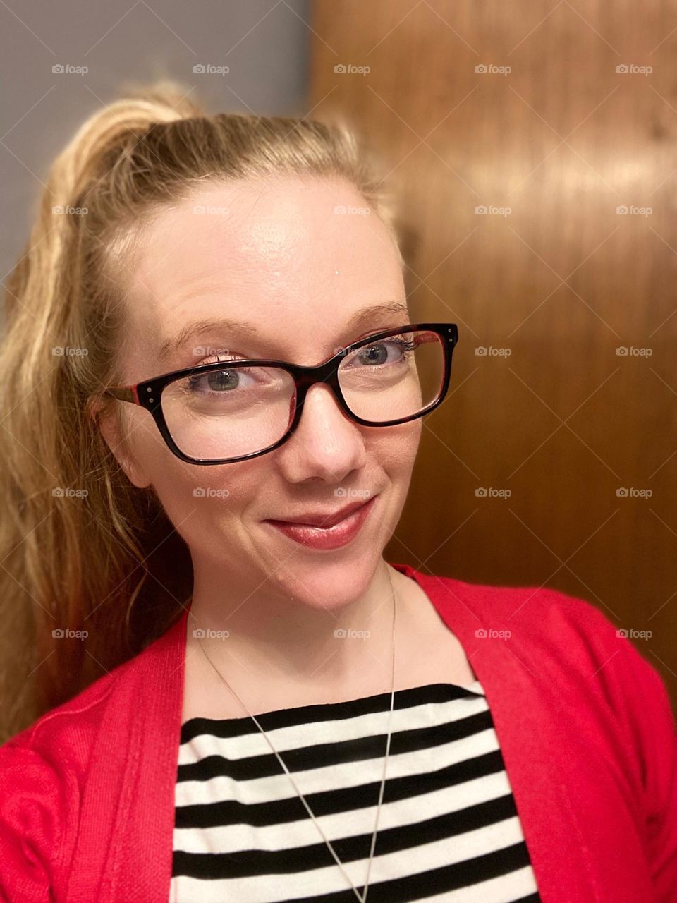 Feeling pretty with my red sweater with boldly striped shirt 