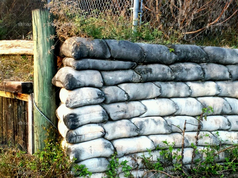 sandbagged. sandbag retaining wall