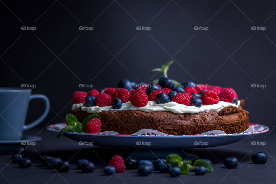 Berry cake with coffee cup