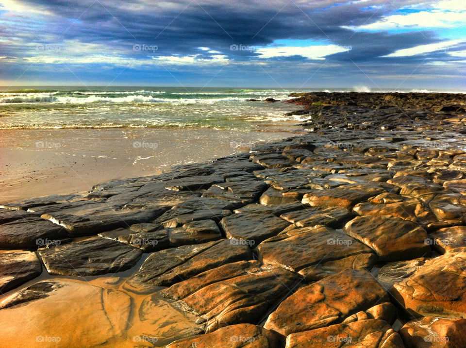 beach clouds rocks australia by goodaussiebloke